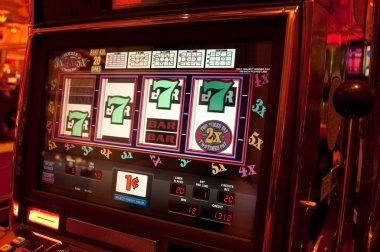 Mobile phone screen displaying Microgaming slot game with touch controls and wisdom77 interface